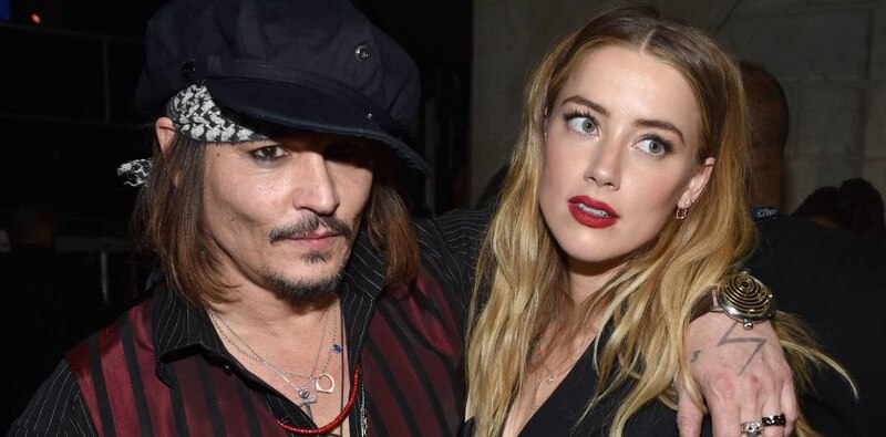 Johnny Depp y Amber Heard en una alfombra roja
