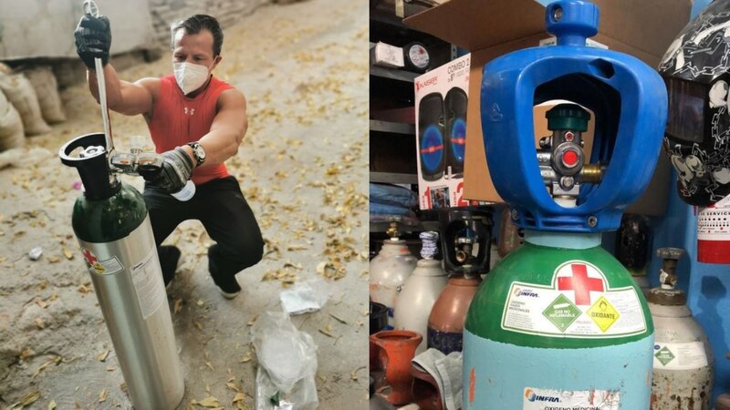 Dos hombres intercambiando tanques de oxígeno