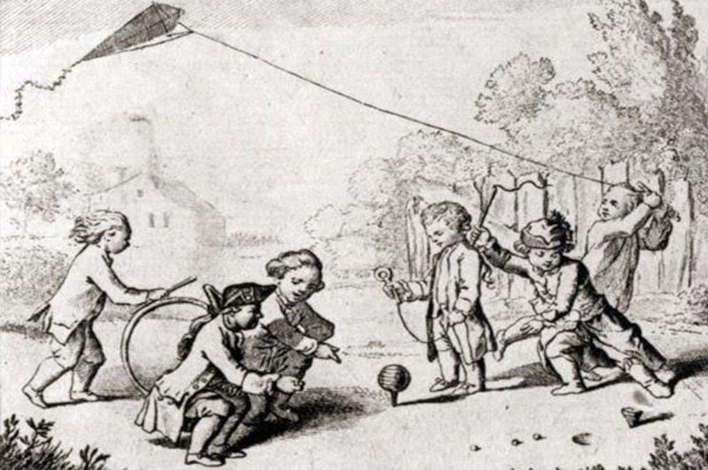 Niños jugando con una cometa
