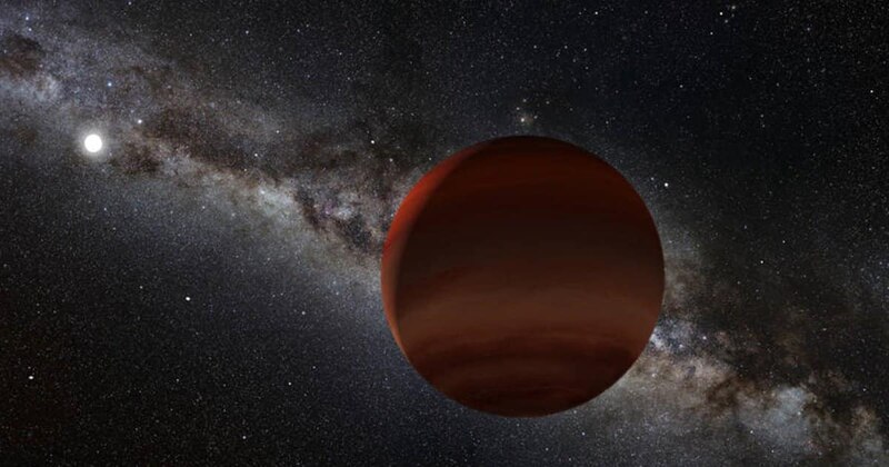 Un planeta rojo brillante brilla en el espacio