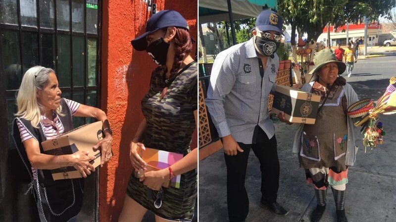 Personas ayudan a una mujer indigena