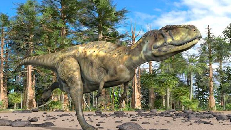 Un dinosaurio carnívoro corre a través de un bosque prehistórico