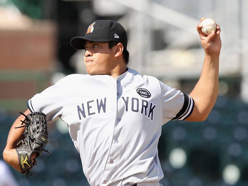 El lanzador de los Yankees, Masahiro Tanaka, lanza una bola rápida durante el partido contra los Medias Blancas de Chicago.