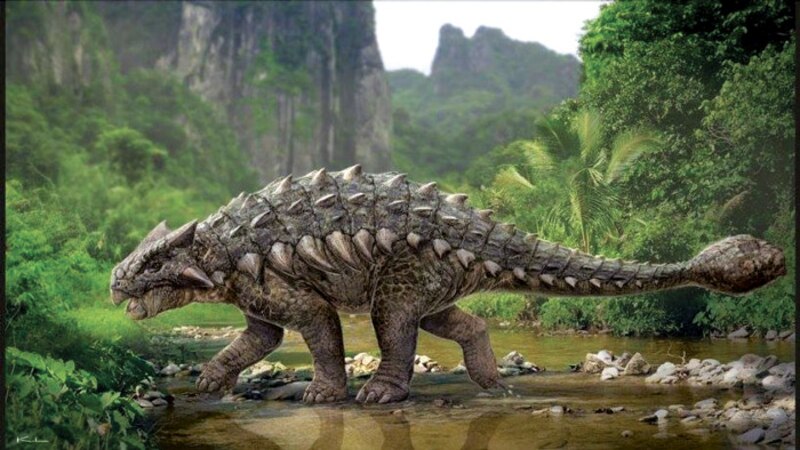 Un dinosaurio anquilosaurio camina por un río