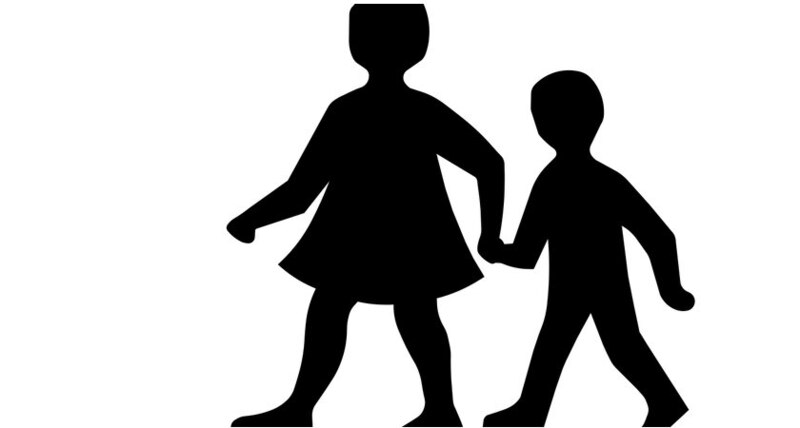 Señal de tráfico de niños caminando