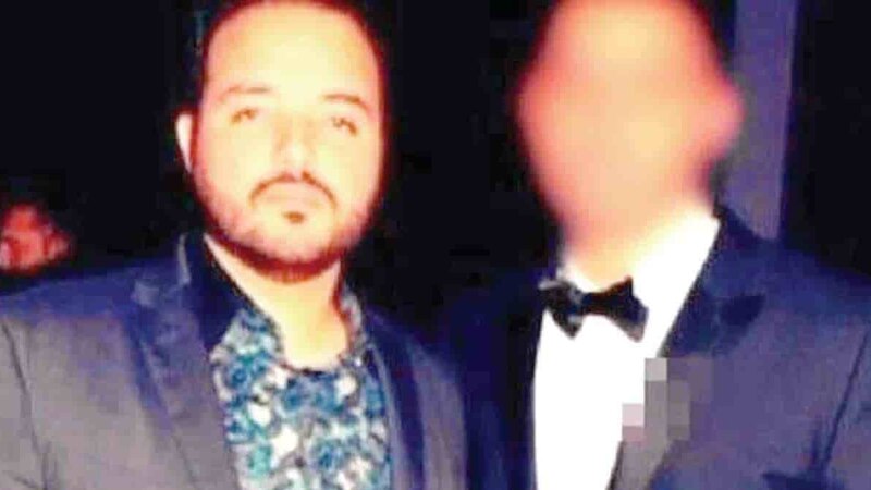 El cantante Ozuna junto a un hombre no identificado