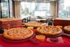 La famosa cochinita de los Diablos Rojos del México llega al estadio en forma de pizza: Pizza Hut lanza “Hut Run” y desata la fiebre del béisbol en la CDMX