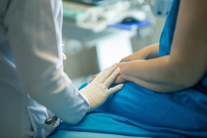 Doctor comforting a patient