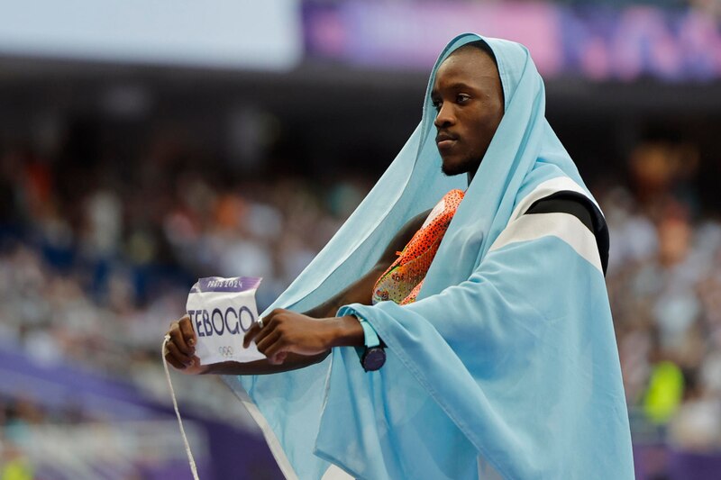 El atleta keniano Eliud Kipchoge celebra su victoria en la maratón de los Juegos Olímpicos de Río 2016.